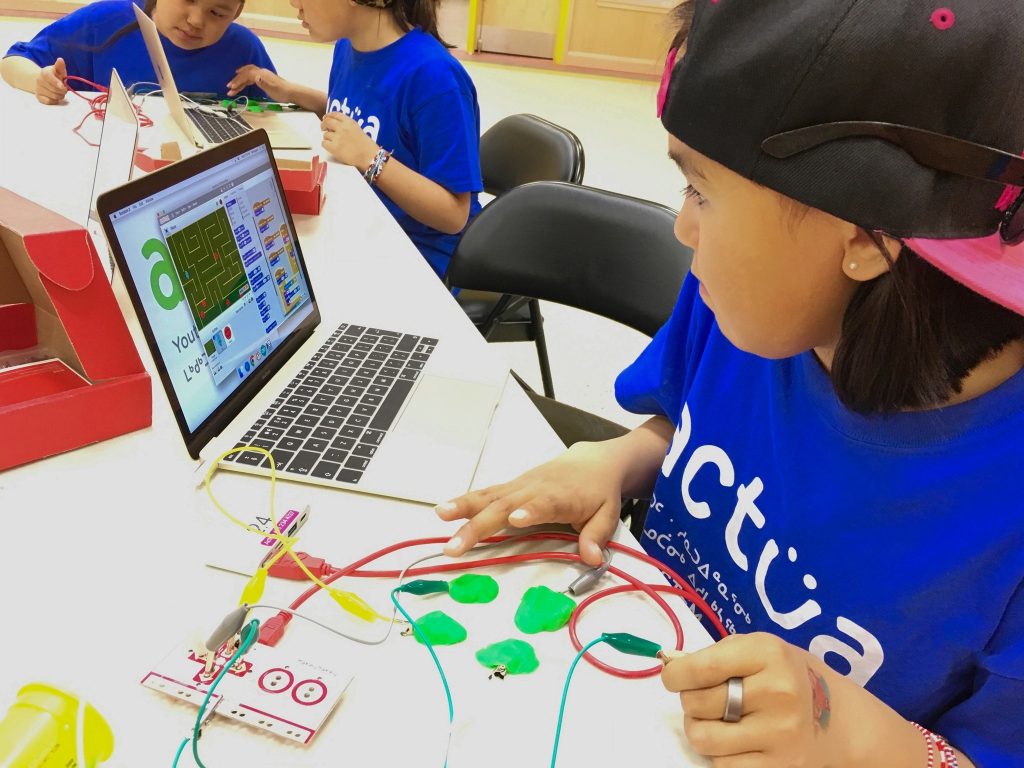 Young female students solving a programming challenge