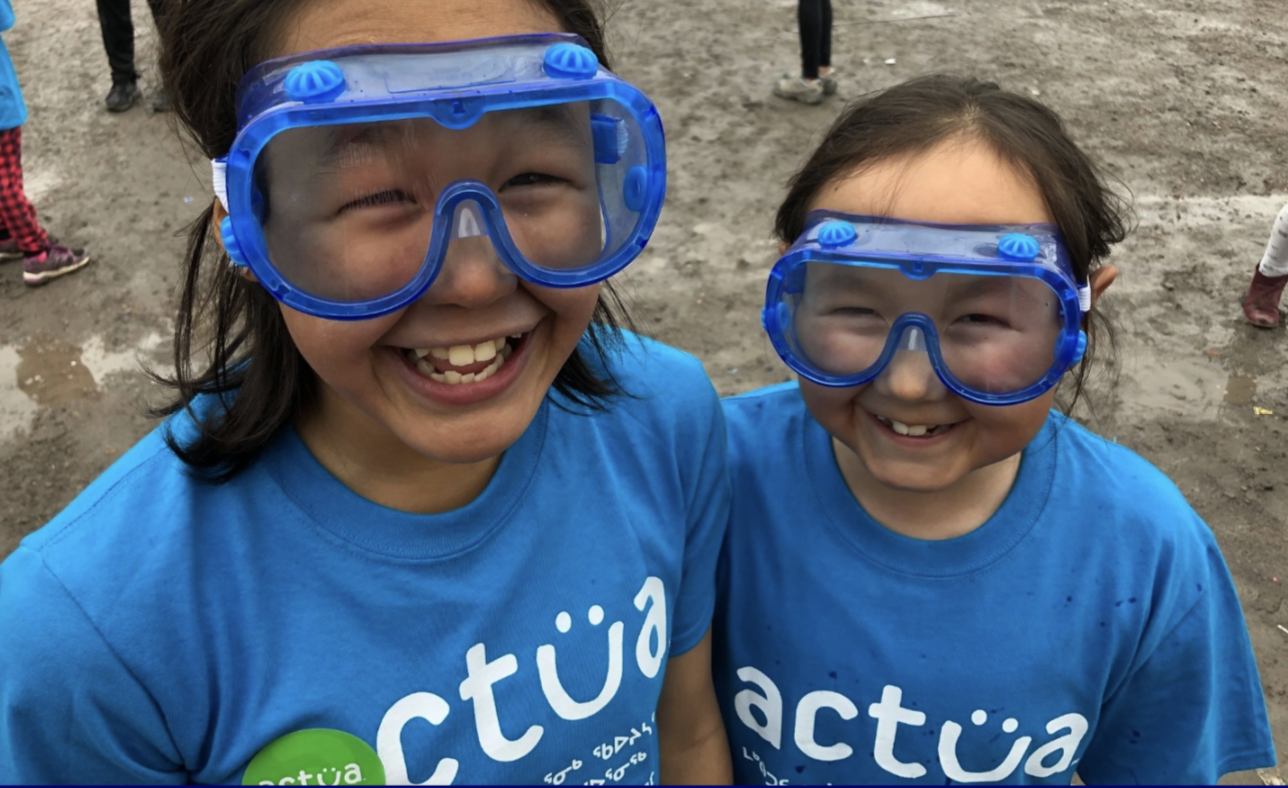 Two young indigenous girls with goggles on.