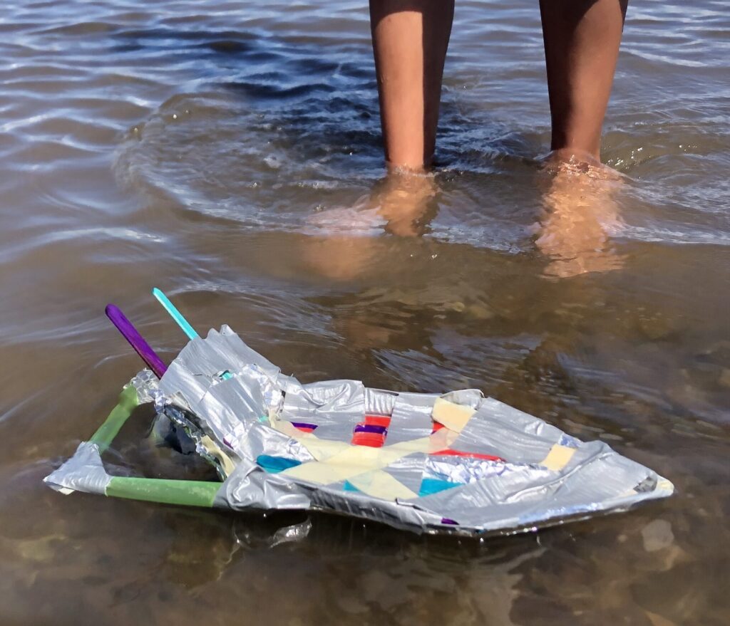 A boat built by students on water
